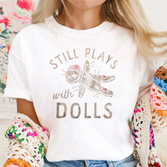 Still Plays With Dolls Funny Creepy Voodoo Curse Tee